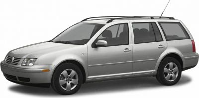 Silver wagon side profile with five-spoke wheels and roof rails
