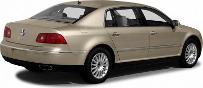 Rear and side view of luxury sedan with alloy wheels and distinctive taillights.