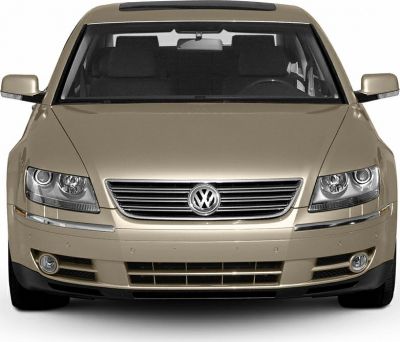 Front view with horizontal chrome grille and dual round headlights
