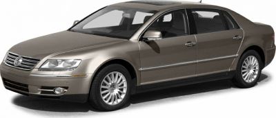 Front side view of a luxury sedan with alloy wheels and chrome trim