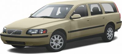 Beige station wagon front side with headlamps and alloy wheels