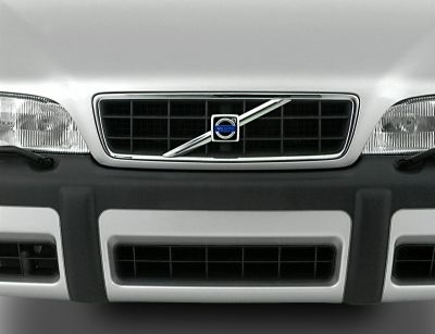 Close-up of front grille and headlights with Volvo emblem.