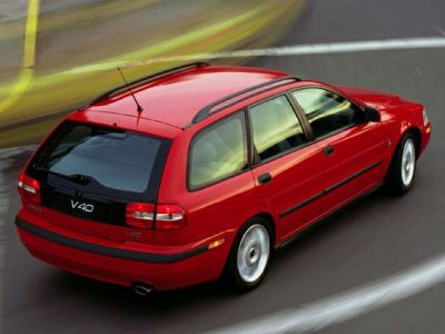 Red station wagon with roof rails and rear design.