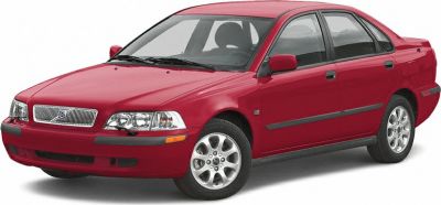 Front side view of a classic compact sedan with alloy wheels and distinct grille