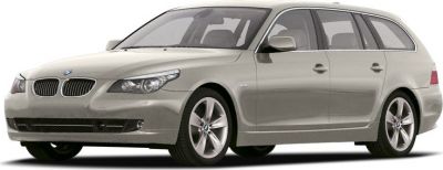 Front side view of a sleek station wagon with alloy wheels and modern headlights