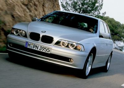 Silver BMW Touring with kidney grille and round headlights in motion