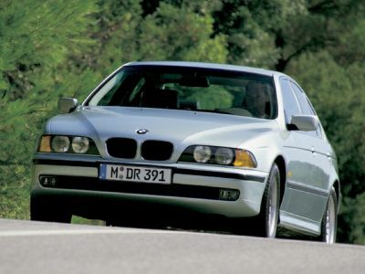 Front view of a classic sedan with kidney grille and quad headlights
