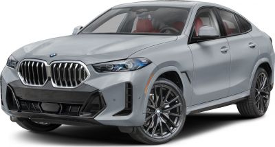 Close-up of front grille, headlight, and sporty wheel of a luxury SUV