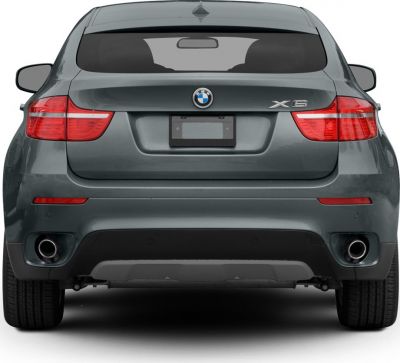 Rear view showing dual exhausts and taillights on SUV.