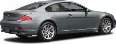 Rear side view of a sleek coupe with alloy wheels.