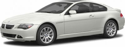 Silver two-door coupe with alloy wheels and sleek design