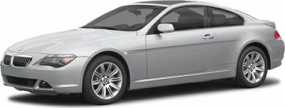 Silver two-door coupe with BMW grille and alloy wheels.