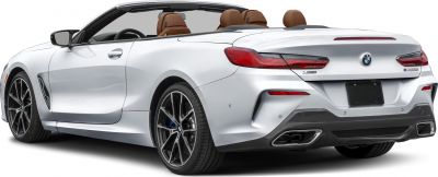 Rear-side view of BMW convertible with open roof and sporty design