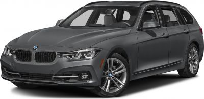Front-side view of a sleek station wagon with distinctive headlights and alloy wheels.