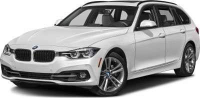 Front side view of a sleek white station wagon with LED headlights and alloy wheels