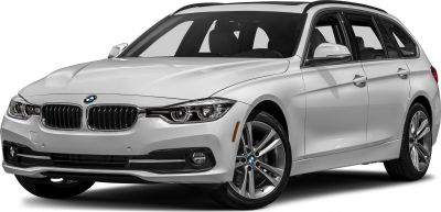 Front side view of white BMW Touring with headlights and alloy wheels