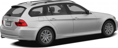 Rear side view of silver station wagon with roof rails and alloy wheels