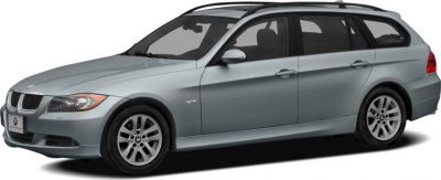 Silver mid-2000s estate with roof rails and sleek lines