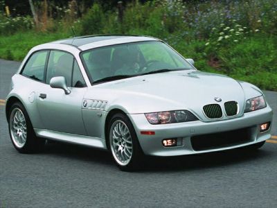 Silver sports coupe with aerodynamic front grille and sporty alloy wheels