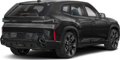 Rear side view with sleek tail lights and quad exhaust tips on black SUV