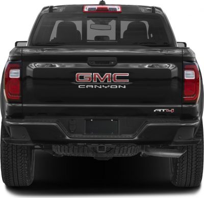 Rear view of pickup with tailgate and AT4 badge