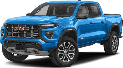 Bold front grille and rugged off-road tires on blue mid-size pickup