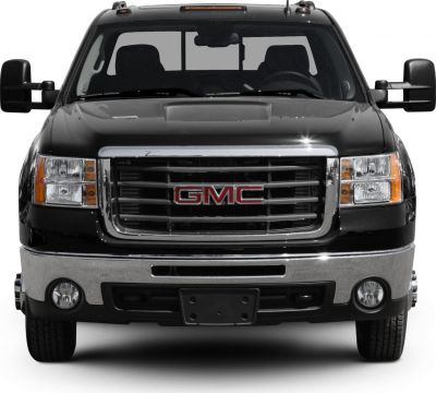 Front view of rugged pickup with prominent grille and extended cab