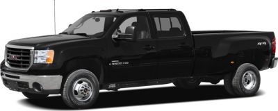 Extended cab long box pickup with dual rear wheels and 4x4 drivetrain