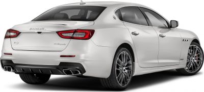 Rear view showing quad exhaust, sleek taillights, alloy wheels