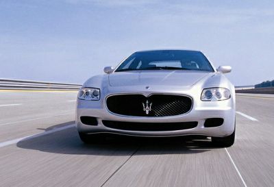 Front view of luxury sedan with prominent grille and sleek headlights