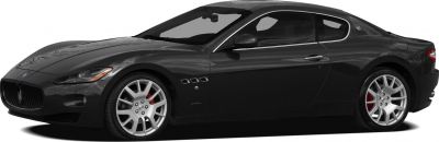Side profile of sleek coupe with silver alloy wheels and red brake calipers