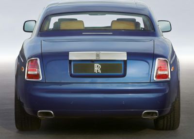 Rear view with distinctive tail lights and dual exhausts