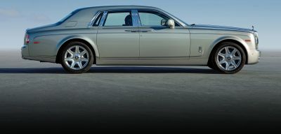 Side profile of elongated luxury sedan with chrome accents