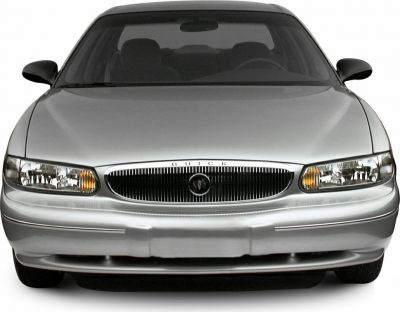 Close-up of front grille, headlights, and smooth bumper of a late 1990s sedan