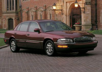 Front-side view of a classic sedan with chrome wheels