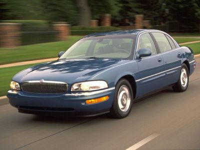 Front and side view of blue luxury sedan with classic design