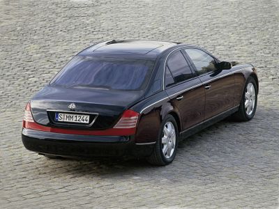 Luxury sedan rear with classic taillights and chrome trim