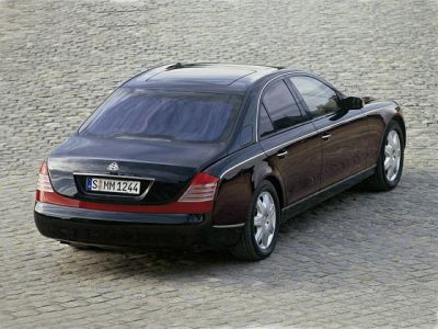 Luxury sedan rear view with sunroof and alloy wheels