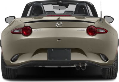 Rear view with dual exhaust, round tail lights, and convertible top