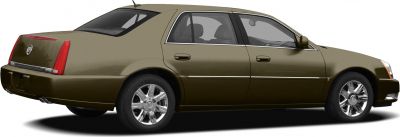 Side rear view of a luxury four-door sedan with chrome wheels