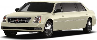 Front side view of a luxury stretch limousine with chrome grille and tinted windows