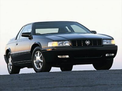 Front view with rectangular headlights and chrome wheels