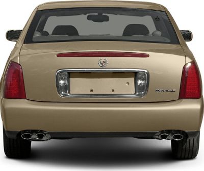 Rear view showing tail lights and dual exhaust of a sedan