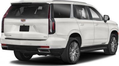 Rear view of luxury SUV with vertical tail lights and large alloy wheels