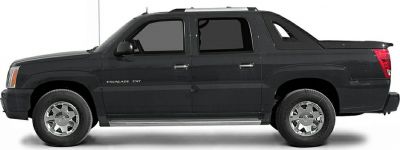 Side profile of a black extended cab pickup truck with chrome wheels