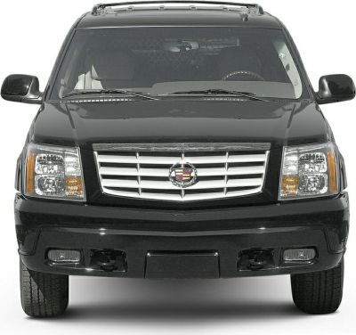 SUV front view with chrome grille, dual headlights, and roof rack