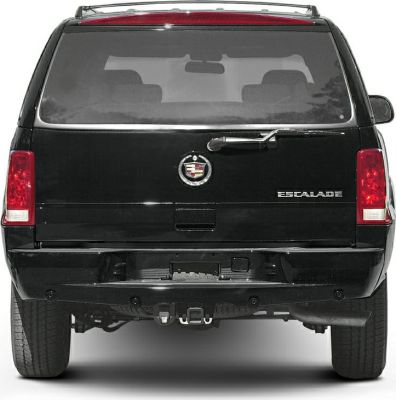 Luxury SUV rear with emblem, large tailgate window, rear wiper, and vertical taillights.