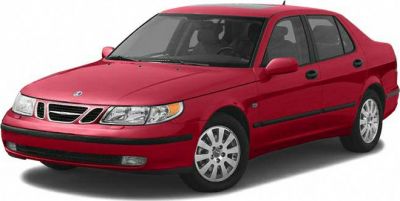 Red sedan with front side view, clear headlamps, alloy wheels