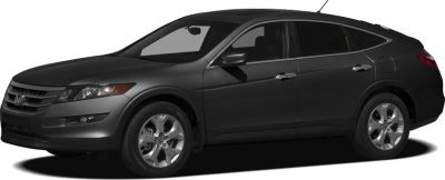 Side profile of a dark-colored midsize wagon with smooth lines and modern wheels