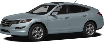 Side profile of a sleek wagon with alloy wheels.